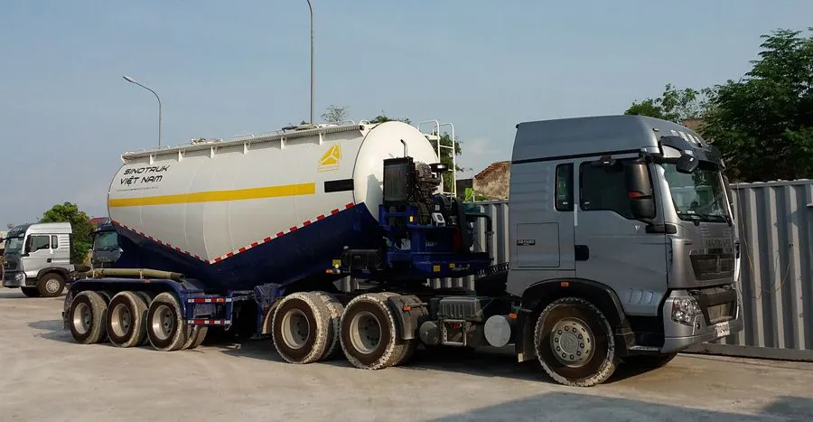 dịch vụ vận chuyển xe tải chở xi măng rời
